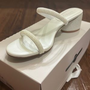 White open toe heels with pearl straps and heel. Size 10. Low heel.